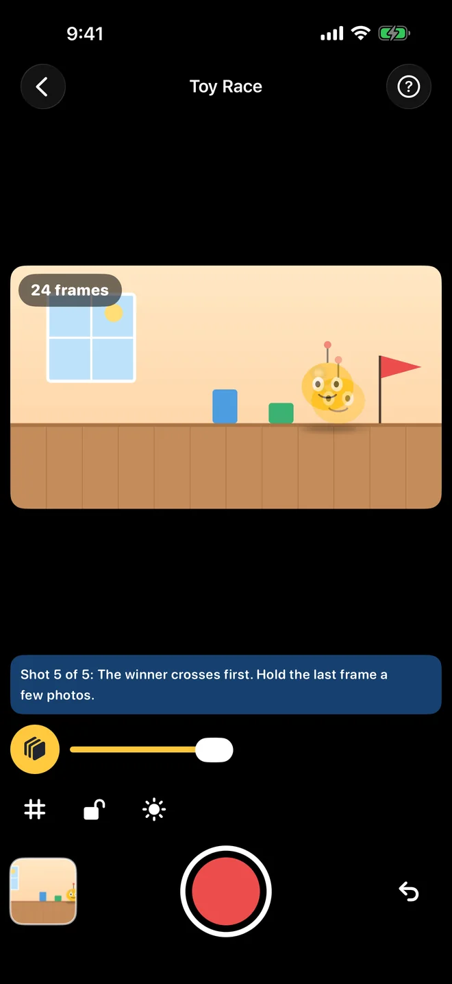 Stop Motion Maker capture screen: the live view of a toy scene with a faded onion-skin ghost of the previous frame, a frame counter and the shutter button